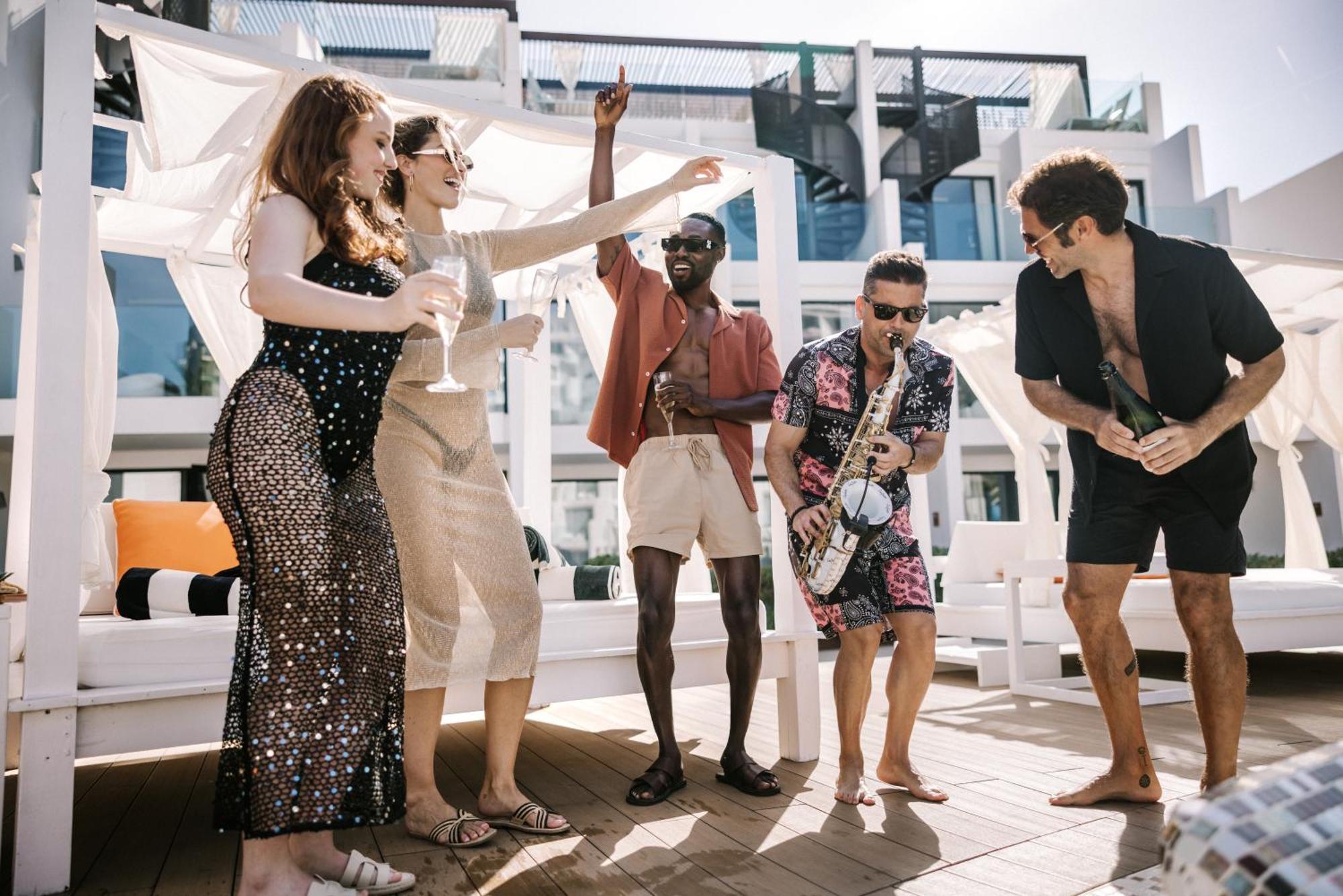 Hard Rock Hotel Ibiza Playa d'en Bossa Exterior photo The band performing on board of a cruise ship